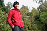 Confident asian man outdoors in red