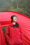Happy asian girl and red tent