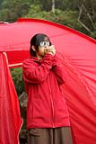 Asian teen girl and red tent