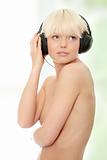 Attractive topless woman with headphones