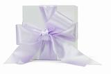 Gift box with large purple ribbon 