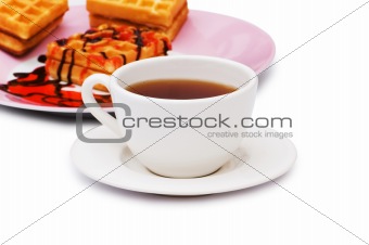 Tea and belgian waffles isolated on the white
