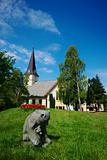 Bear Statue and White Church