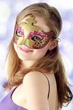 Young woman wearing carnival mask