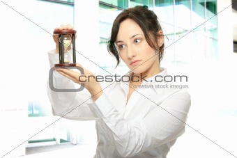Young business woman with hourglass