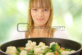 Young woman cooking food