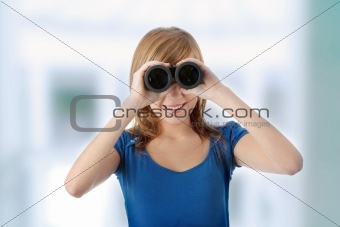 Teen girl with binoculars