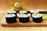 Traditional Japanese food maki rolls on a wooden board