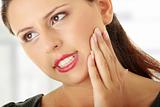 Young woman is having toothache