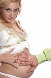 touching abdomen of beautiful pregnant woman