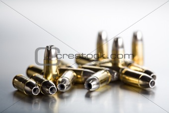 bullets closeup on cold brushed metal