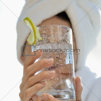 Woman holding drink.