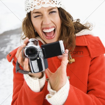 Woman with video camera.