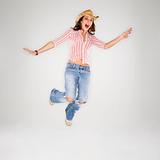 Cowgirl leaping into air.