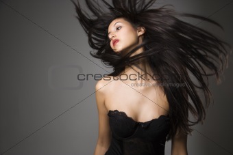 Woman flinging long hair.