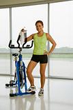 Woman with exercise bicycle.