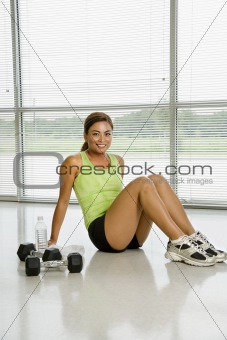 Female weightlifter resting.