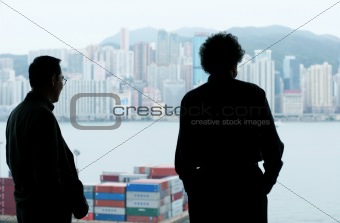 Two businessmen looking out of the window