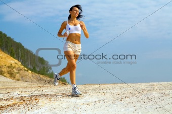 girl runs on sand