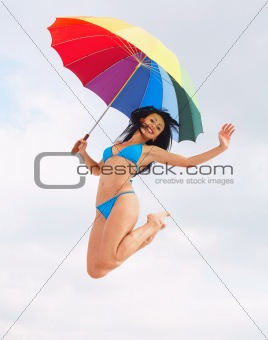 Bikini lady jump with umbrella