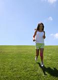 Girl running on grass
