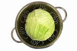 Fresh cabbage in a colander with water-drops on white isolated.