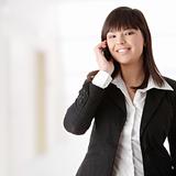 Young businesswoman using cell phone
