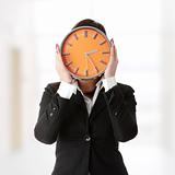 Businesswoman with clock