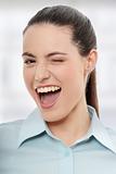 Businesswoman with big smile blinking