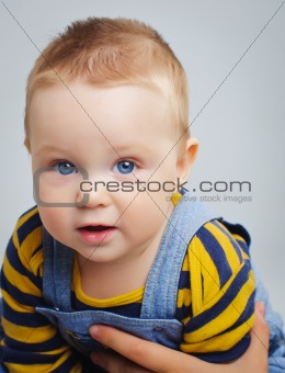 Vertical portrait of cute little boy