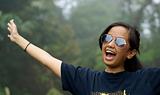 Happy laughing  asian teen girl outdoors