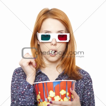 Women in stereo glasses eating popcorn. 