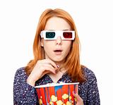 Women in stereo glasses eating popcorn. 