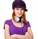 Beautiful red-haired girl with headphones. 