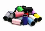 lot of colored thread spools