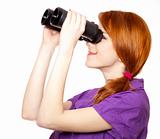 Teen red-haired girl with binoculars isolated on white backgroun