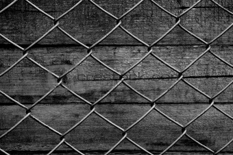 chain link fence see old wooden background