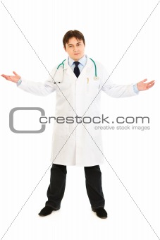Smiling medical doctor spreading his hands apart
