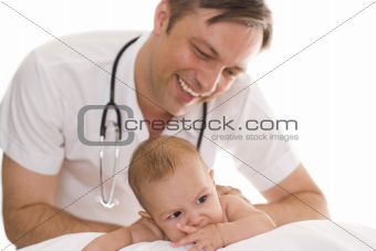 doctor examining newborn