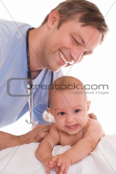 doctor examining newborn 