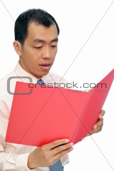 Surprised business man reading paper