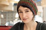Portrait of a beautiful young brunette in a colorful beret