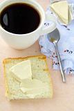 Toast with butter and a cup of black coffee