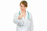 Strict medical female doctor shaking her finger
