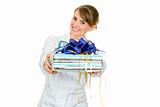 Smiling medical female doctor holding gift in hands 
