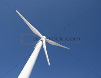 Windmill against deep blue sky