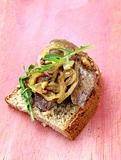 sandwich with grilled liver and onions on rye bread