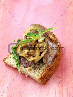 sandwich with grilled liver and onions on rye bread