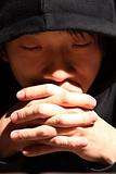 Closeup portrait of a young man praying to god