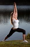 young woman yoga lake